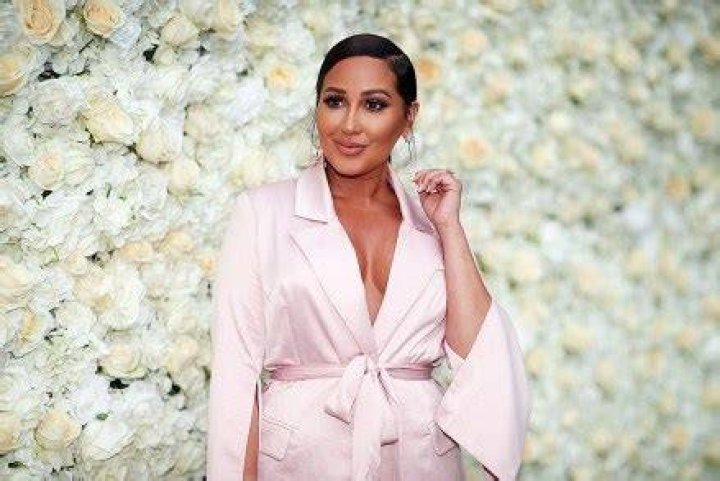 Adrienne Bailon Debuts Hair Makeover After Dying Roots Black – Hollywood Life