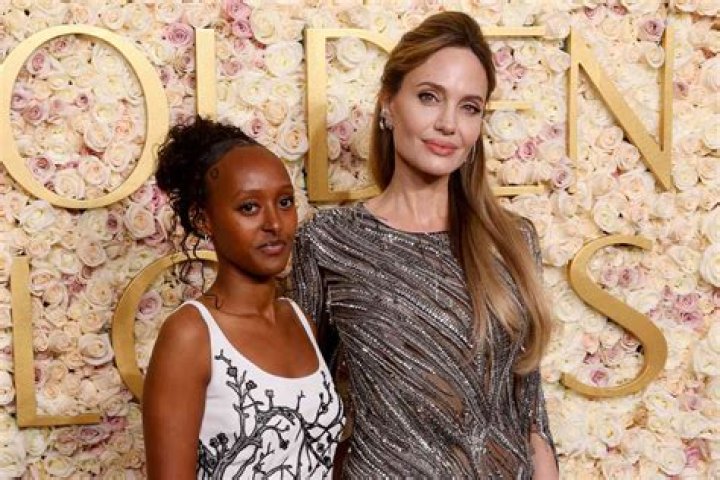 Angelina Jolie’s Daughter Zahara, 16, Is Stylish In A Red Dress On Grocery Store Run With Mom