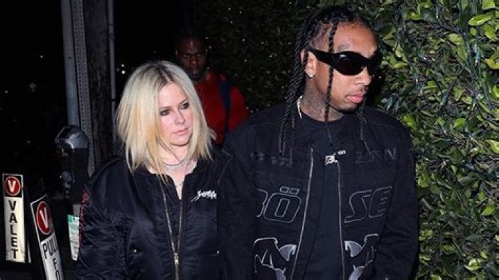 Avril Lavigne & Tyga Hold Hands As They Arrive Back In California For Date Night After PFW: Photos