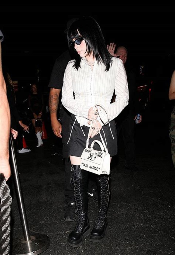 Billie Eilish Rocks Thigh High Boots & Mini Skirt To Kaia Gerber’s 21st Birthday: Photos