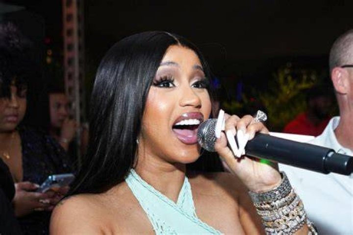 Cardi B Flaunts Cleavage In Skimpy Bra Top As She Rocks Neon Blue Wig – See Pic