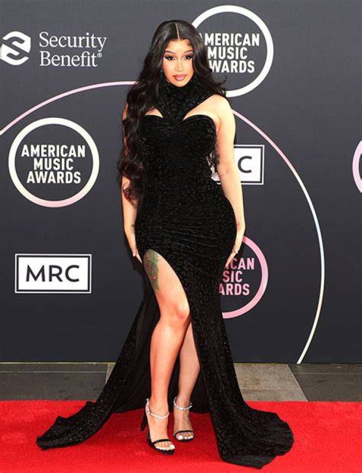 Cardi B Stuns In Black High-Slit Dress For Red Carpet Rollout Ahead Of AMAs