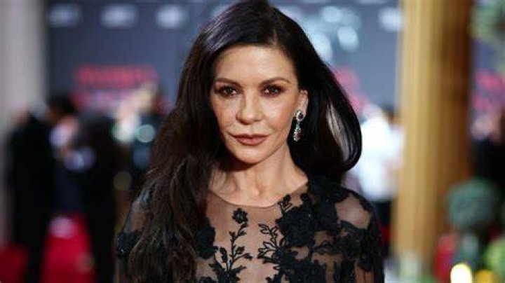 Catherine Zeta-Jones Looks Gorgeous In Black Dress With High Slit At Golden Globes