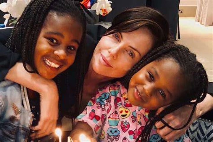 Charlize Theron Skis With Adorable Daughters Jackson, 9, & August, 6: ‘Merry Christmas’ — Photos