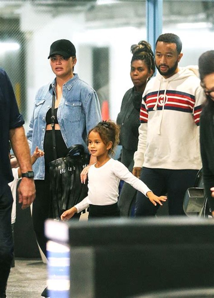 Chrissy Teigen Bares Baby Bump In Black Crop Top For Family Movie Date: Photo