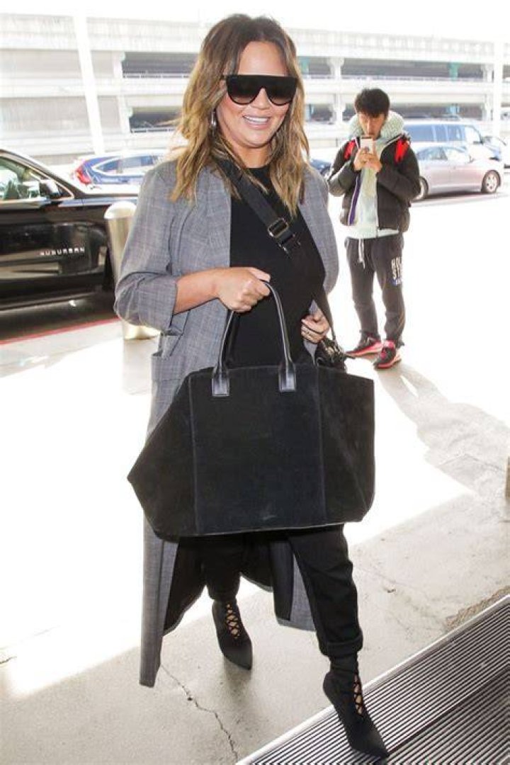Chrissy Teigen Hiding Her Bump In Fabulous Outfits — PICS