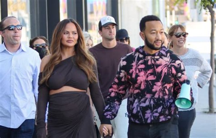 Chrissy Teigen Playfully Displays Her Bare Baby Bump While Striking A Fierce Pose — See Pic
