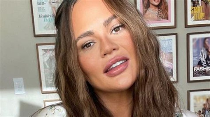 Chrissy Teigen Shows Off Implant-Free Breasts In Swimsuit As She Struggles To Make Them Go ‘Up’
