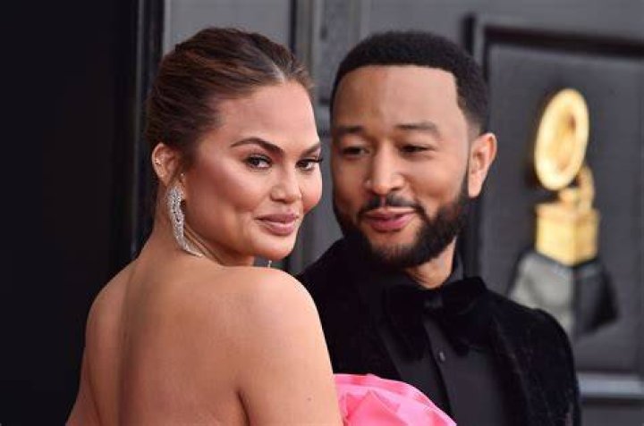 Chrissy Teigen Turns Heads In Bright Pink Strapless Gown At 2022 Grammy Awards: Photos