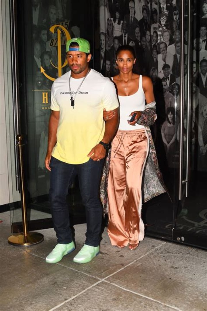 Ciara Stuns In Tight Tank Top & Sweetly Holds Russell Wilson’s Arm On Date – Pic