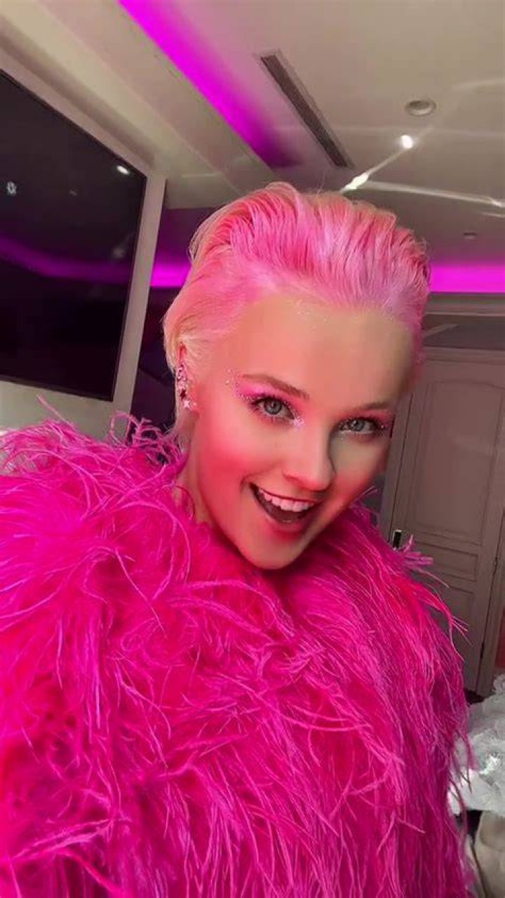 Debuts Hot Pink Color In Video – Hollywood Life