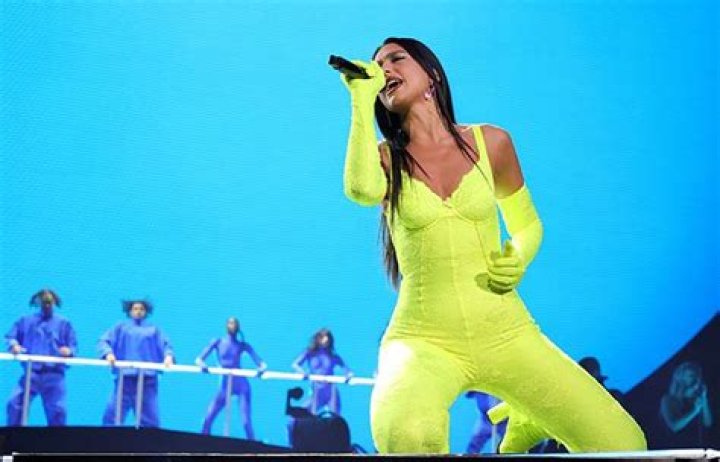 Dua Lipa Hits Las Vegas Stage In Neon Catsuit & Gloves: Photos – Hollywood Life