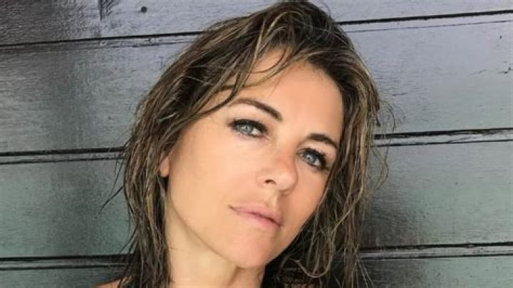 Elizabeth Hurley, 54, Shows Off Incredibly Toned Figure In Sexy Striped Bikini From Swimwear Brand