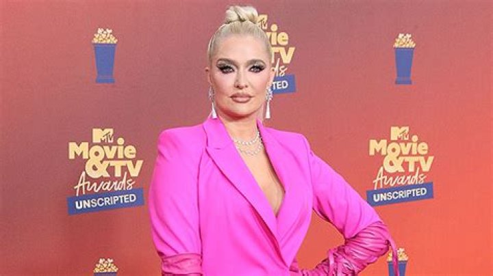 Erika Jayne Covers Herself With Just Her Long Blonde Hair As She Poses For Sexy Photo