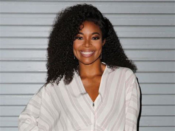 Gabrielle Union, 48, Glows In Cheeky White Swimsuit: ‘Cheers To The Weekend’ — Photos