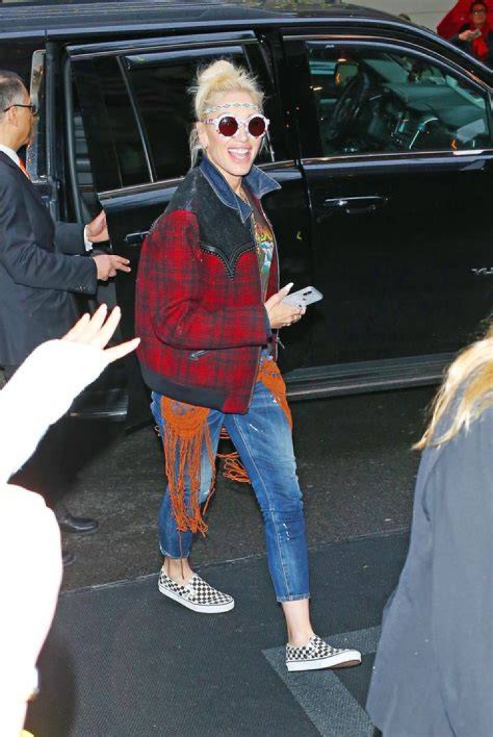 Gwen Stefani Rocks Fringe Jeans & ‘Blake’ Jacket After Arriving In NYC For Met Gala — See Pics