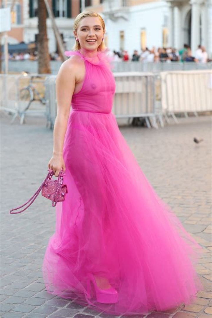 Hailey Baldwin Sizzles In Pink Dress With Sexy Plunge & Platform Boots At PFW – Photos