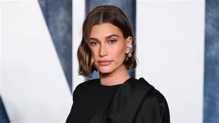 Hailey Bieber Rocks Blue Bikini & Shows Off Glowing Makeup-Free Skin In New Photos