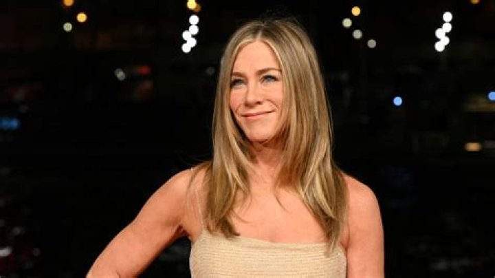 Jennifer Aniston, 50, Rocks Sexy Leather Mini Showcasing Long Legs & Cuddles With Adam Sandler – Pics