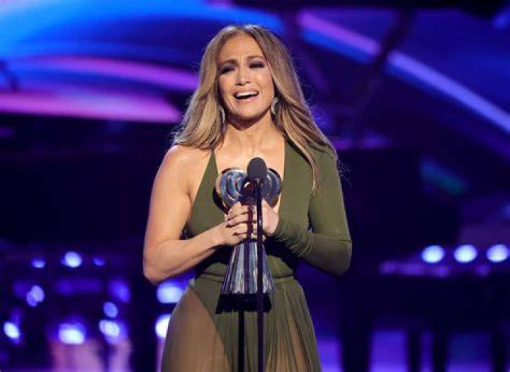Jennifer Lopez Accepts Icon Award In Natural Glam & Cozy Cardigan At Billboard Women in Music
