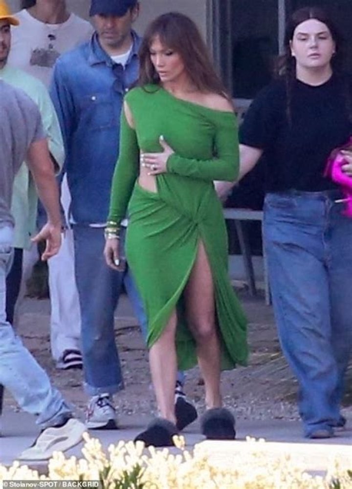 Jennifer Lopez Shows Some Serious Leg In High-Cut Red Dress As She Dances Around Set