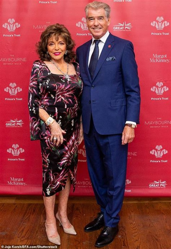 Joan Collins, 90, Looks Fabulous in Gorgeous Floral Dress With Pierce Brosnan at Prince’s Trust Lunch