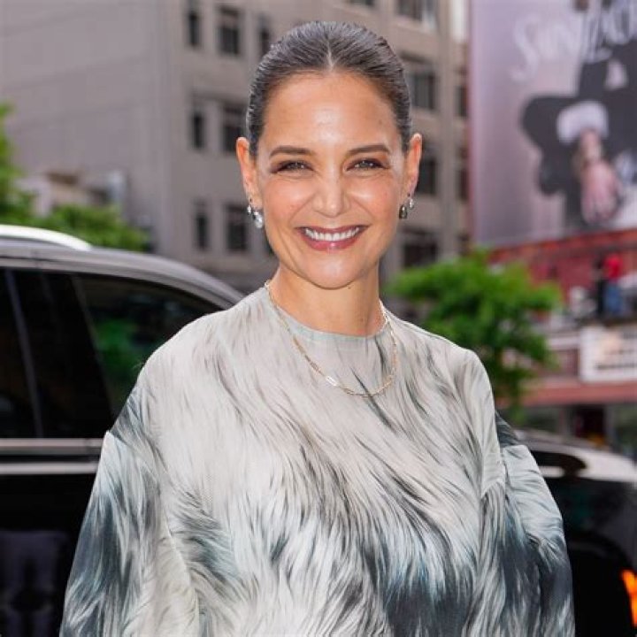 Katie Holmes Looks Ethereal In White Dress While Visiting The Lion King & Jungle Festival In Paris