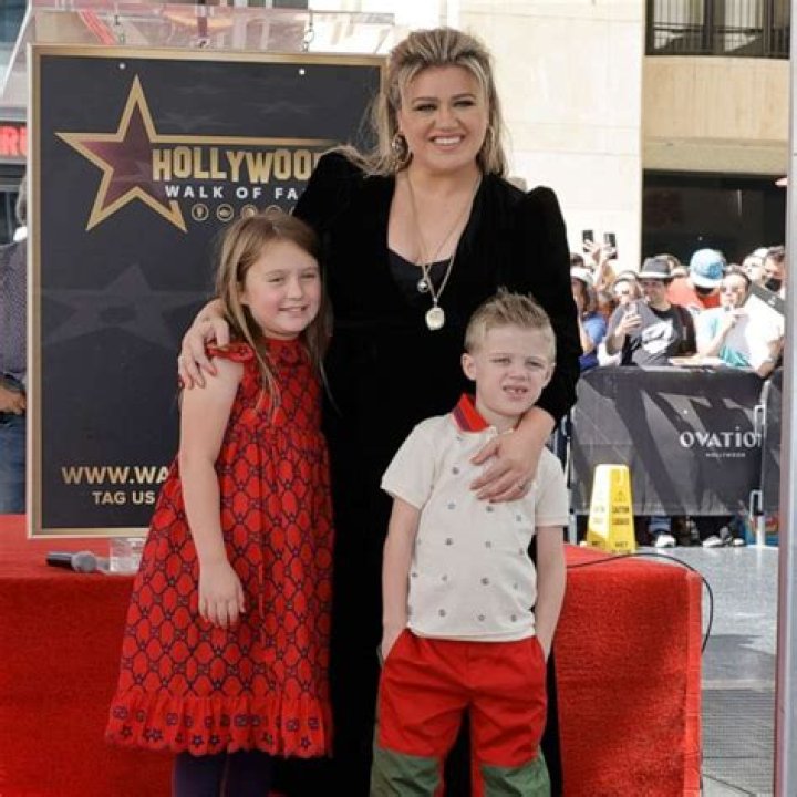 Kelly Clarkson Cuddles Up To Her Kids River, 7, & Remington, 5, On Family Trip To Disney World — See Rare Pic