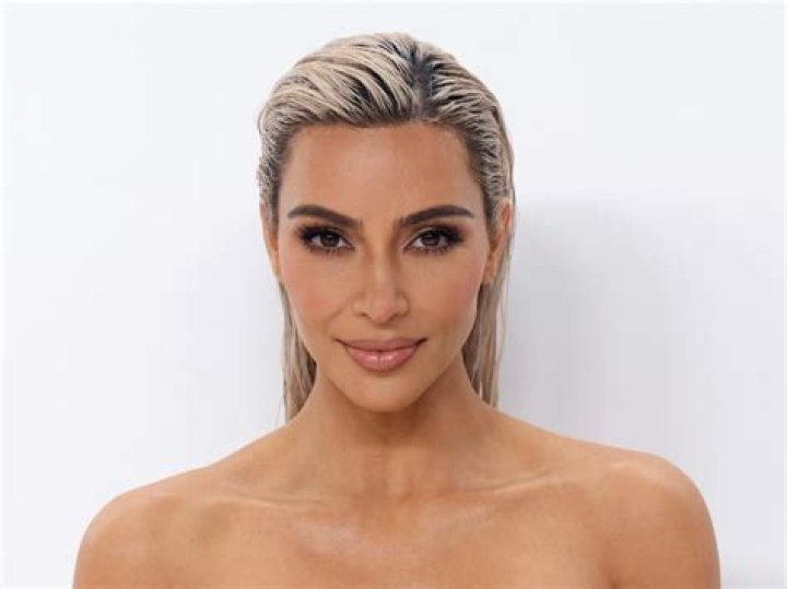 Kim Kardashian Rocks A Black Bikini To Sunbathe On A Hammock In the Water 