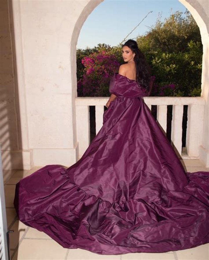 Kim Kardashian Rocks Purple Leather Dress & Matching Coat In Stunning New Photos