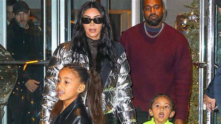 Kim Kardashian Shares Precious Pic Of Saint, Chicago, & Psalm Cuddled Together In Matching PJs