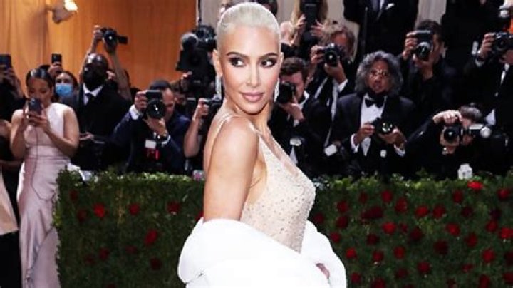 Kim Kardashian Slays White Crop Top, Ruffled Skirt & Thigh-High Stockings For Sexy SKIMs Shoot