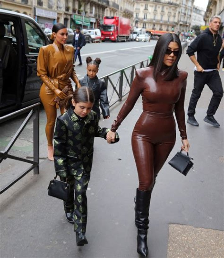 Kim & Kourtney Kardashian Stun In Skintight Latex Outfits At Kanye’s Sunday Service In Paris