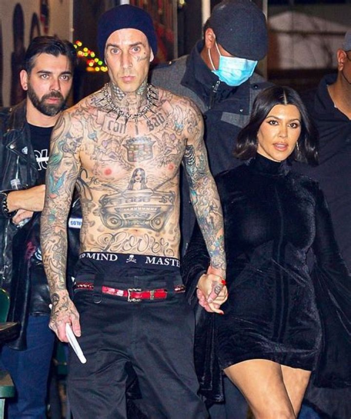 Kourtney Kardashian Rocks Plunging Tank Top & Holds Hands With Travis Barker On Outing — See Pics