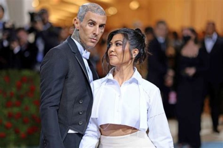 Kourtney Kardashian Slays LBD & Holds Hands With Travis Barker In NYC Ahead Of Met Gala