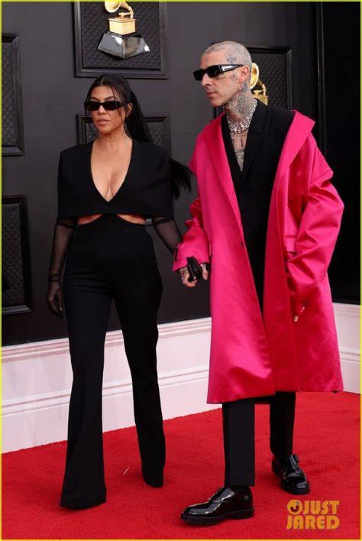 Kourtney Kardashian & Travis Barker Share A Steamy Kiss On Grammys Red Carpet: Photos