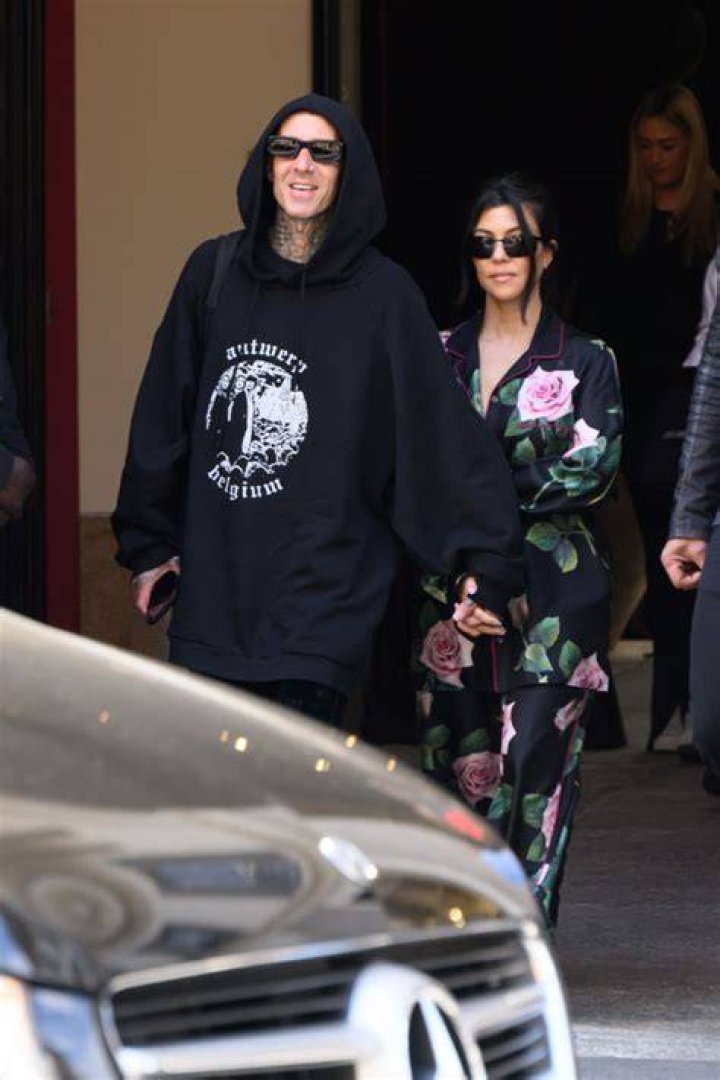 Kourtney Kardashian Wears Rose Pajamas Holding Travis Barker’s Hand On Last Day In Italy