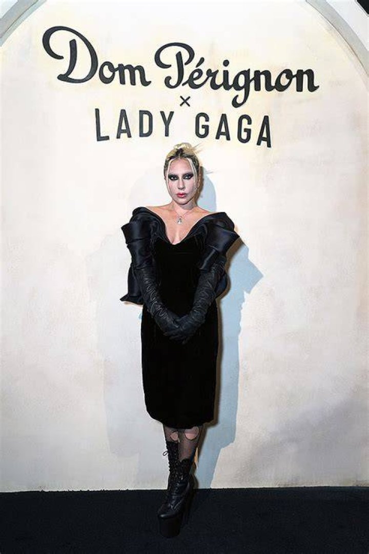 Lady Gaga Rocks Ripped Fishnet Stockings & Ghostly Makeup To Dom Perignon Event