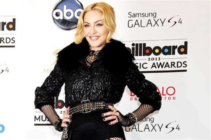 Madonna Reveals Massive Bruise Down Her Entire Thigh While Rocking Versace In New Photos