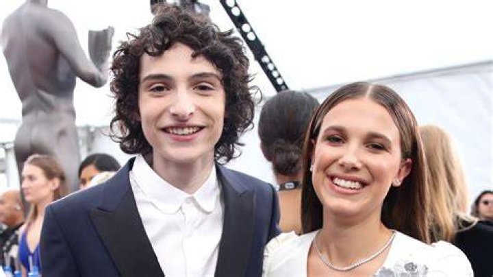 Millie Bobby Brown Poses With Finn Wolfhard & Jake Bongiovi On Set – Hollywood Life