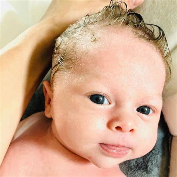 Nikki Bella Shares Adorable PDA Pics Of Artem Chigvintsev Cradling Her Baby Bump On Instagram