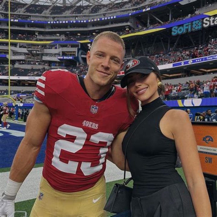 Olivia Culpo Hits The Pool In A Bikini & Makes Out With BF Christian McCaffrey In New Photos