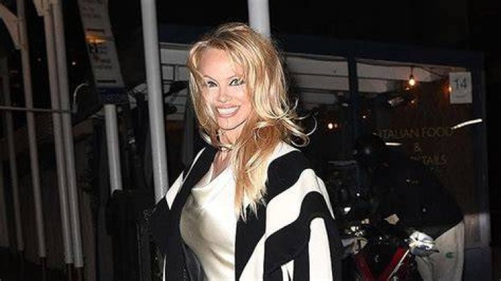 Pamela Anderson Is A Goddess In Slinky White Dress For ‘Pamela, A Love Story’ After Party: Photos