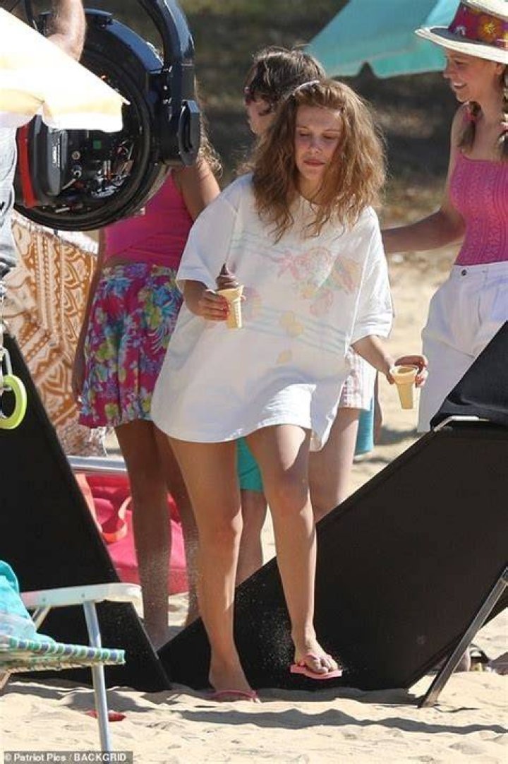 Rihanna Flaunts Sizzling Bikini Body On Beach While Feeding Baby Monkey — Pics