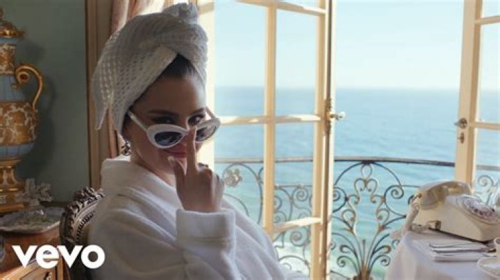Selena Gomez Rocks Nothing but a Bathrobe While Lounging in Seaside Hotel Room in Sexy ‘Love On’ Music Video
