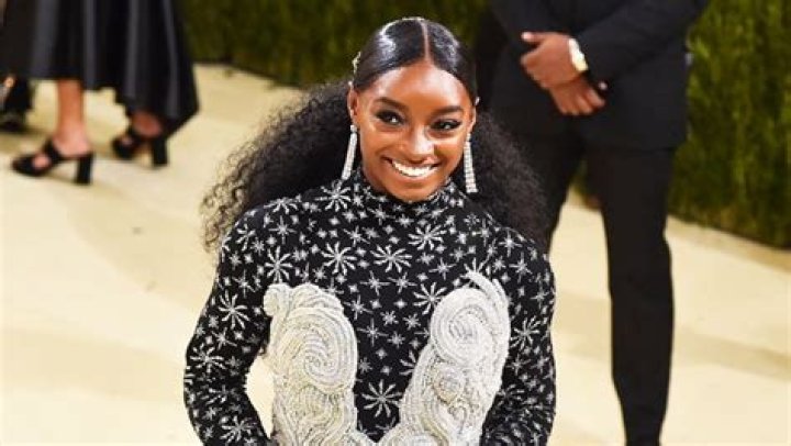 Simone Biles Cuddles Fiancé Jonathan Owens While Wearing $500 Burberry Swimsuit