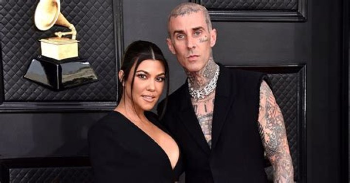 Travis Barker Removes Kourtney Kardashian’s Garter With Teeth At Wedding Reception: Watch
